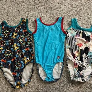 Plum gymnastics leotards, size child large, lot of 3.